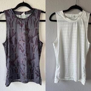 Zyia active tank top bundle size XS 
White one has a faint stain on the back
